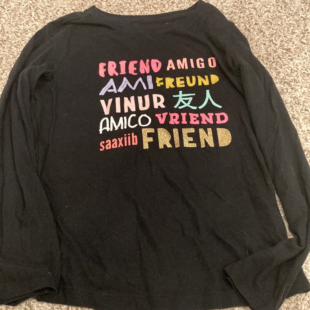 Kids shirt, black with the word “friend” in other languages